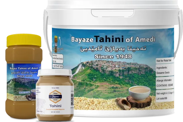 Fresh tahini in traditional buckets and jars